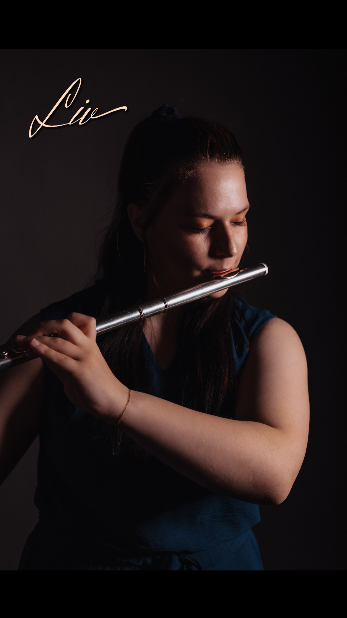 Mrs. Liv playing flute